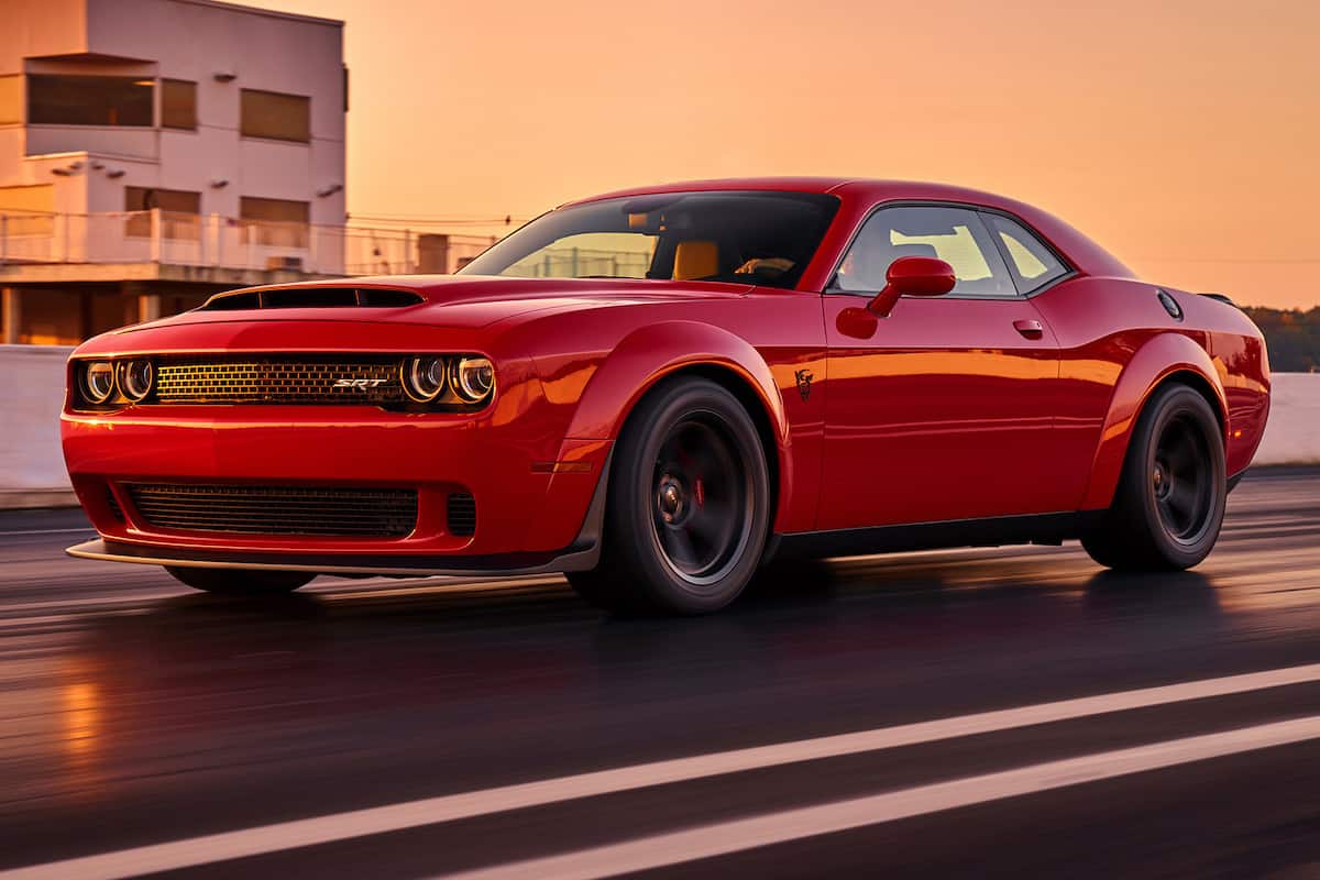 Japanese sports car races sunset.