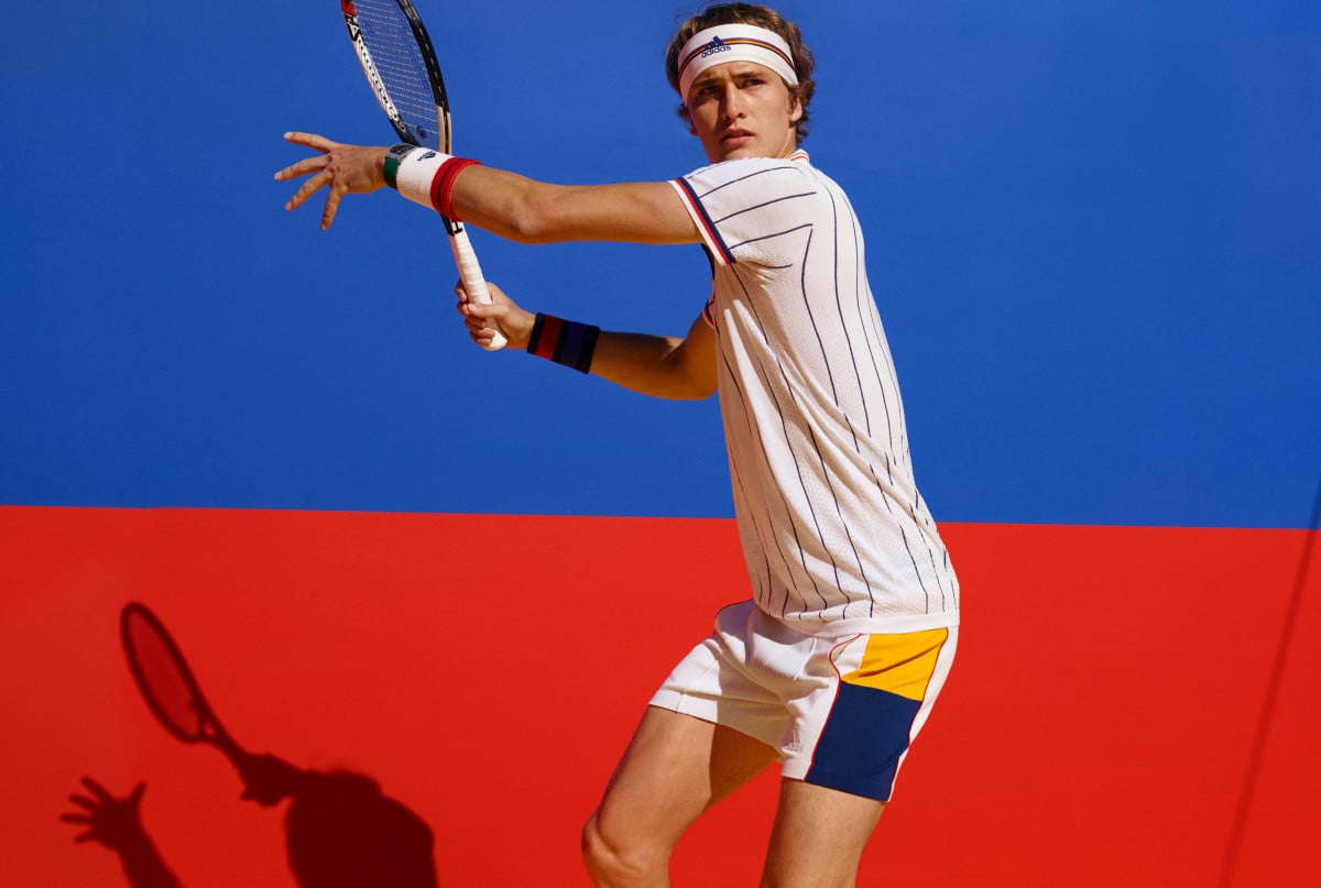 Tennis player wearing branded attire.