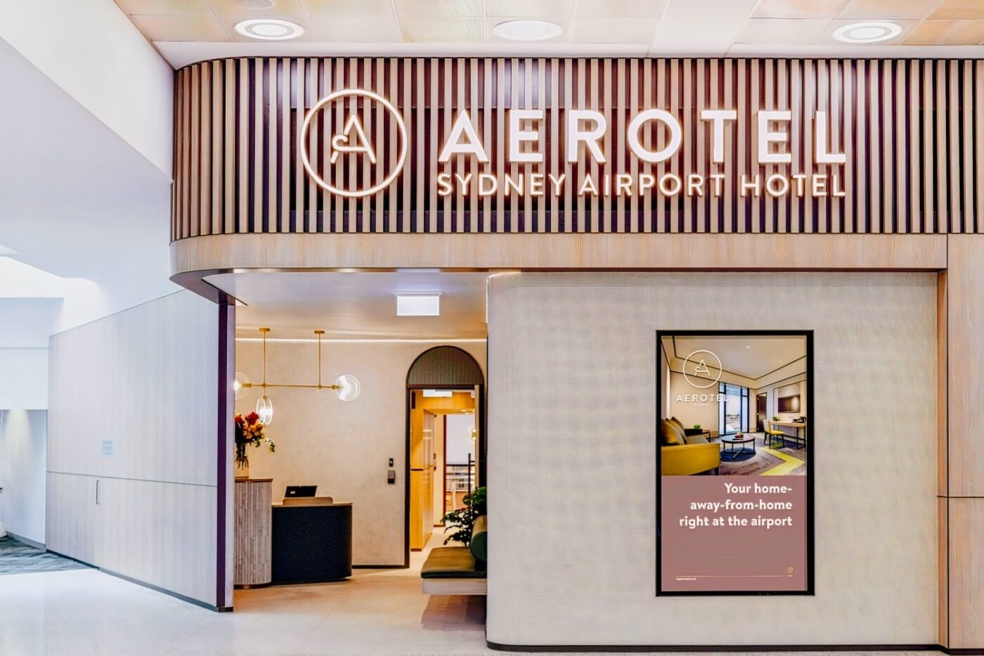 Aerotel Sydney: Elegant entrance, inviting digital display.