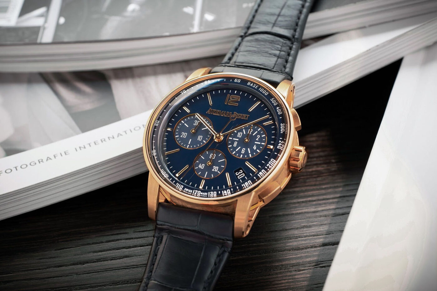 Patek Philippe rose gold watch featured in magazine.