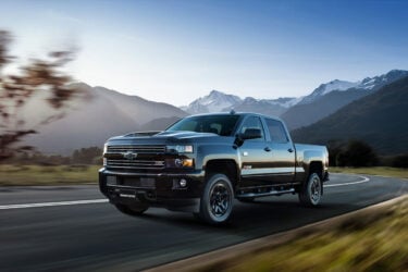 Gray ute drives with stunning Australian backdrop.