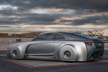 Sleek, futuristic car parked on rooftop.