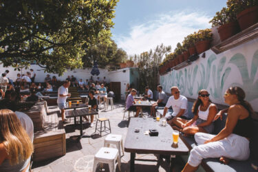 Bondi Pubs' lively patio with drinks and conversations.