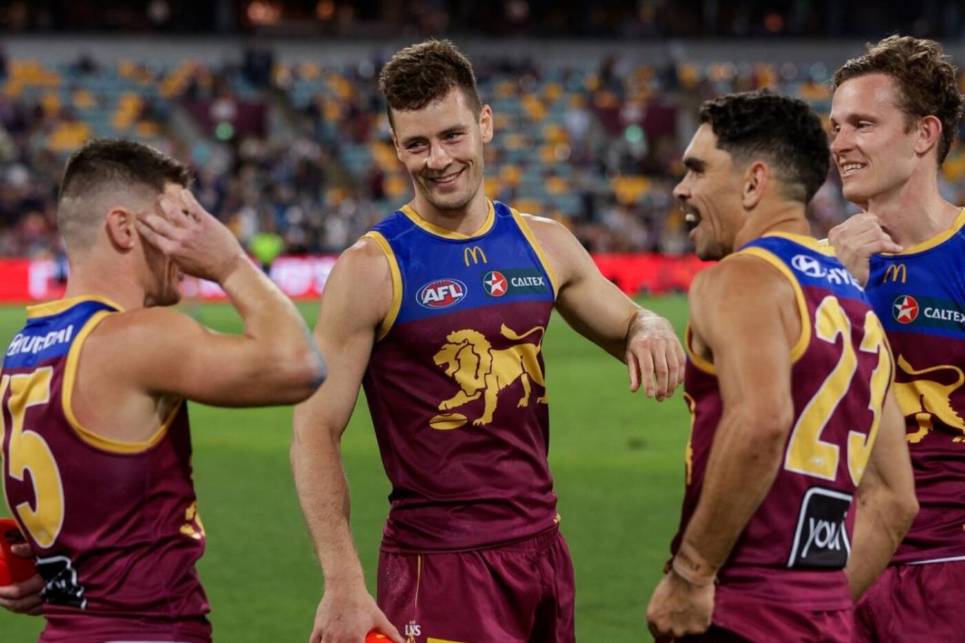 Brisbane Lions celebrate after game.