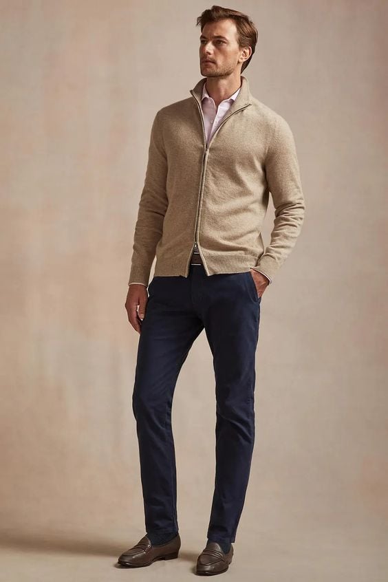 A man wearing smart casual cardigan and chino.