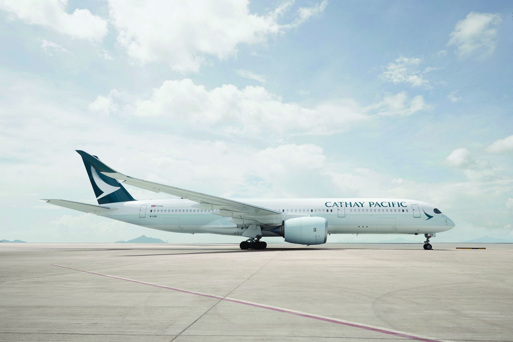 Cathay Pacific plane on runway.