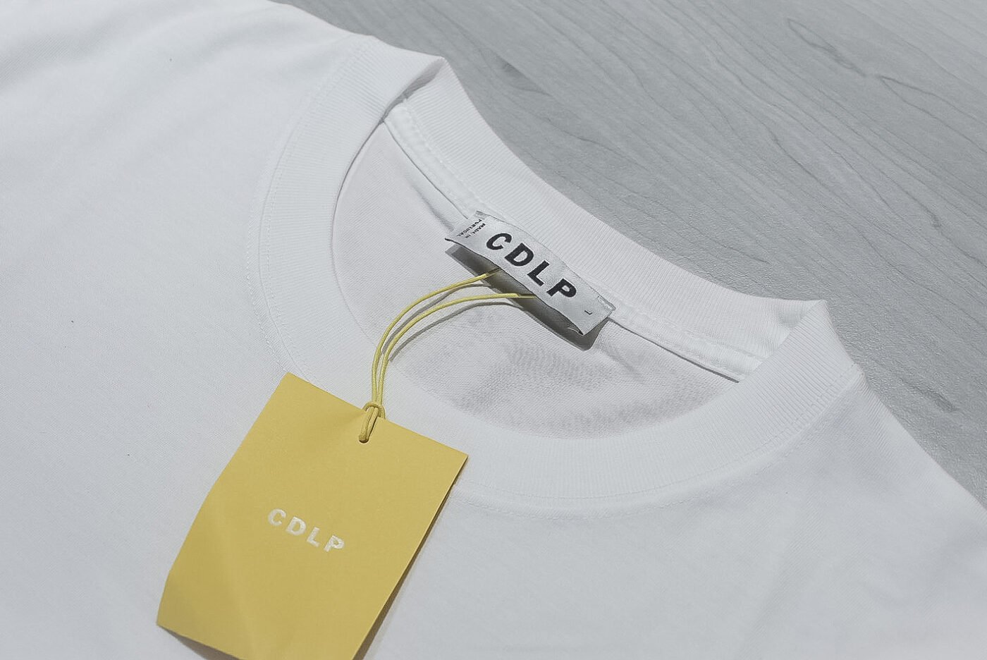 CDLP white tee collar and label close up 