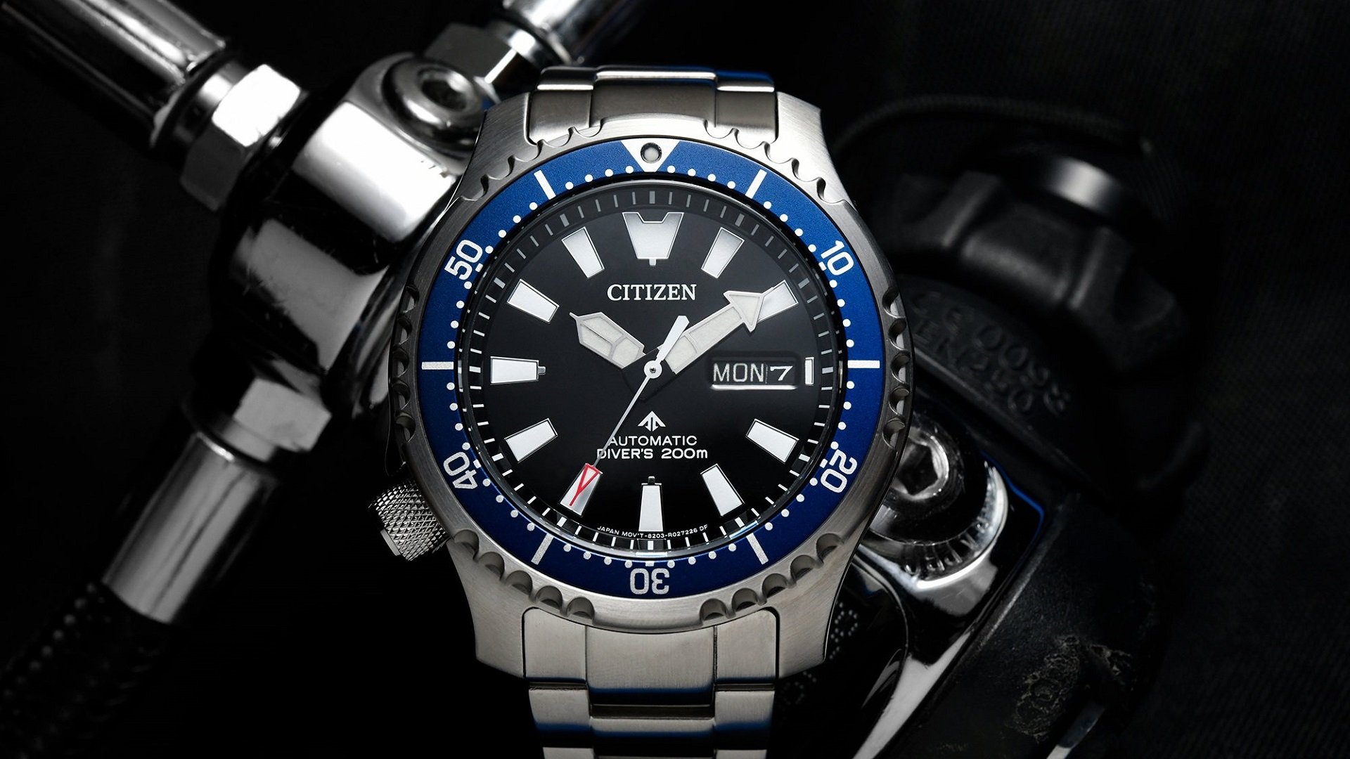 Citizen diver watch on wrist.