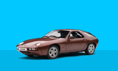 Porsche 928 against blue background.