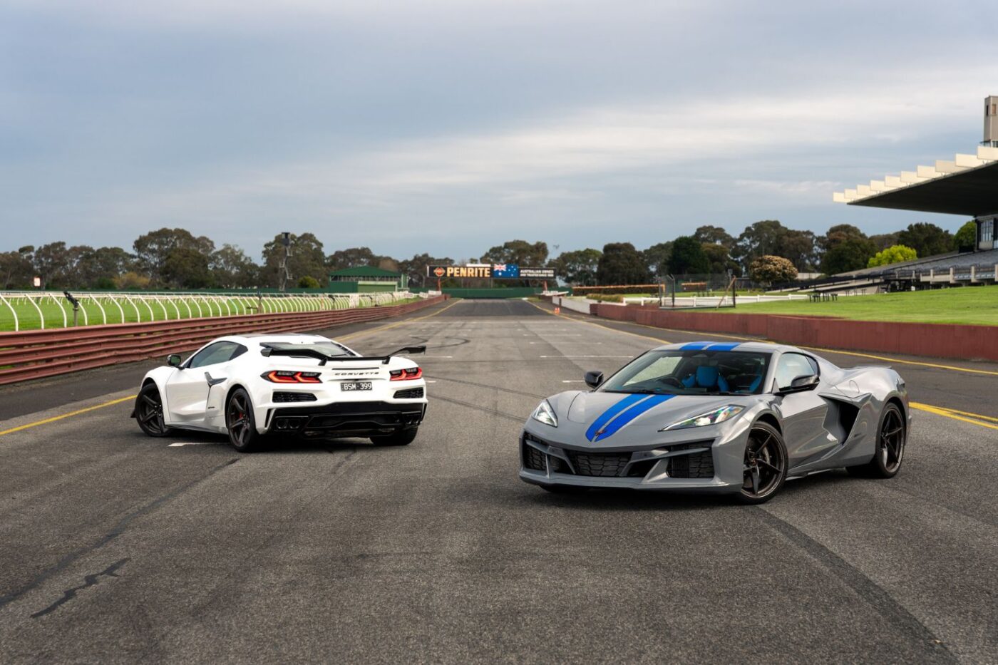 Corvette and silver car parked in Melbourne.