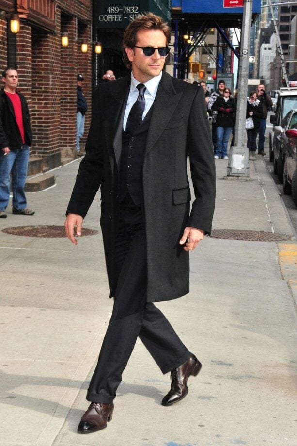 Man in suit walks downtown.