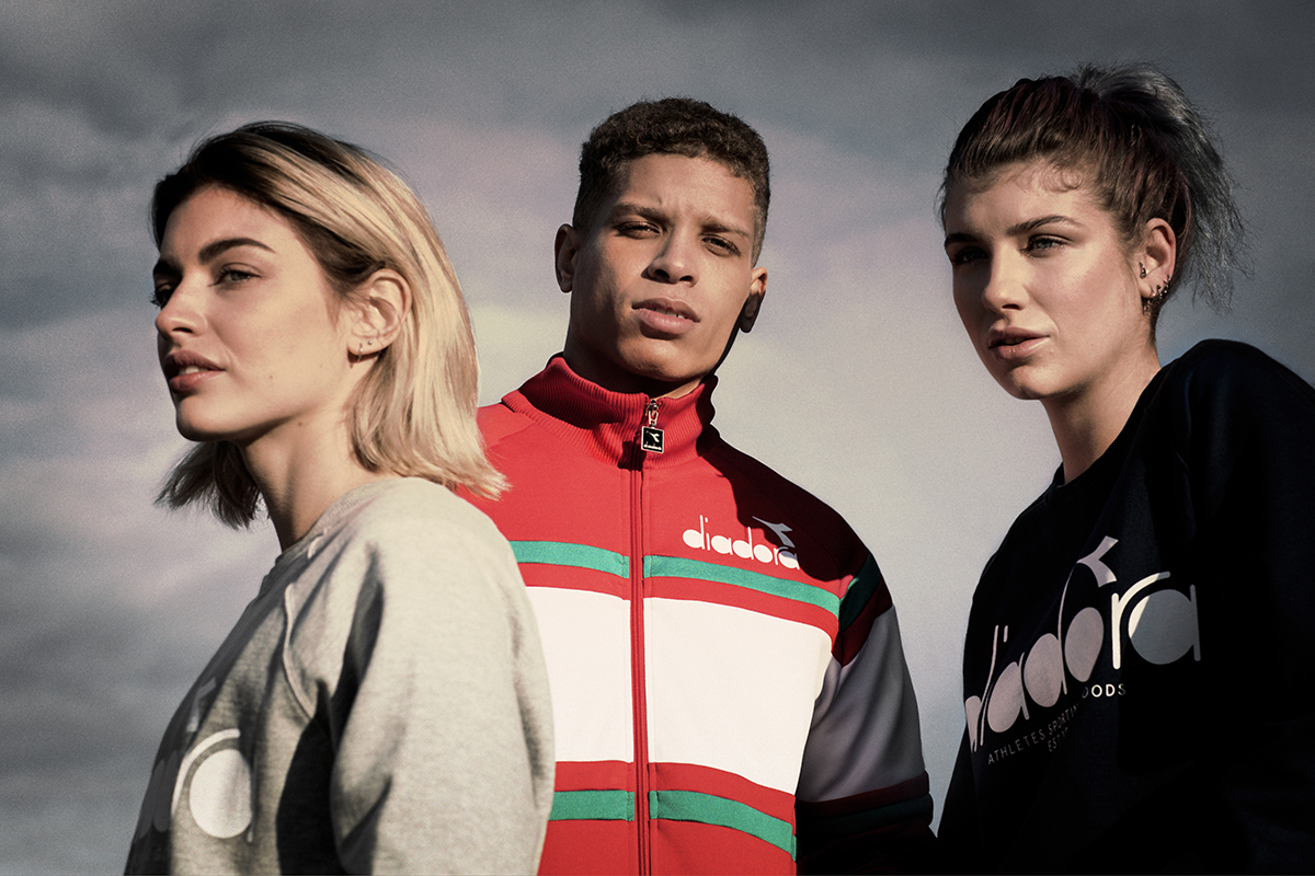 Models pose in Diadora clothing.