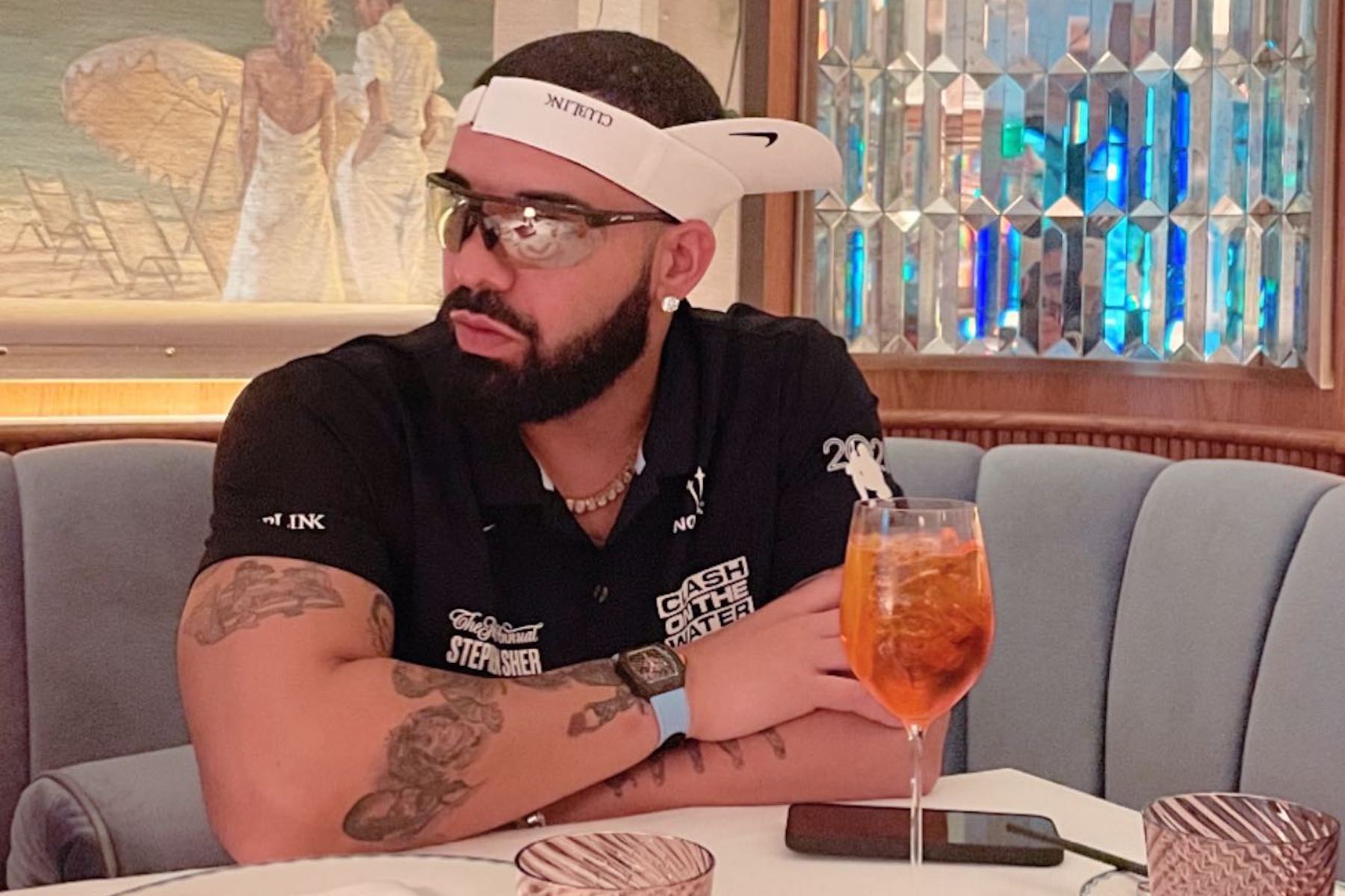 Bearded man in restaurant with Richard Mille.