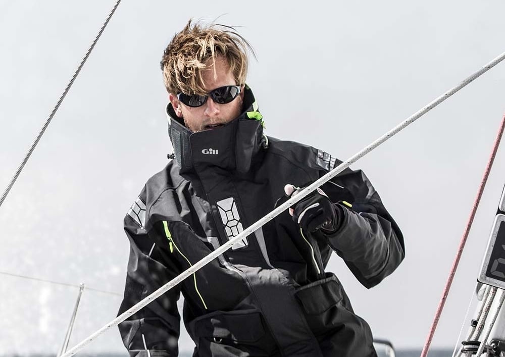 Person on sailboat with gear.