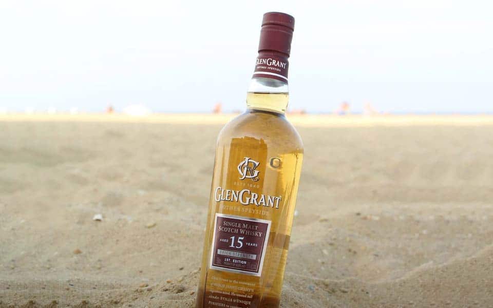 Glen Grant 15-year-old whisky on a beach.