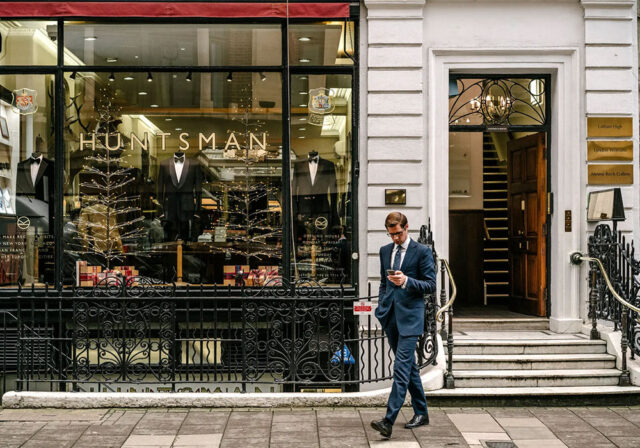 Man walks by Huntsman, Savile Row.