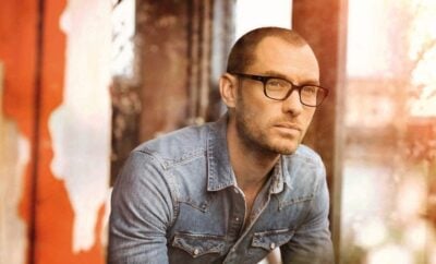 Man in denim, bald, glasses.