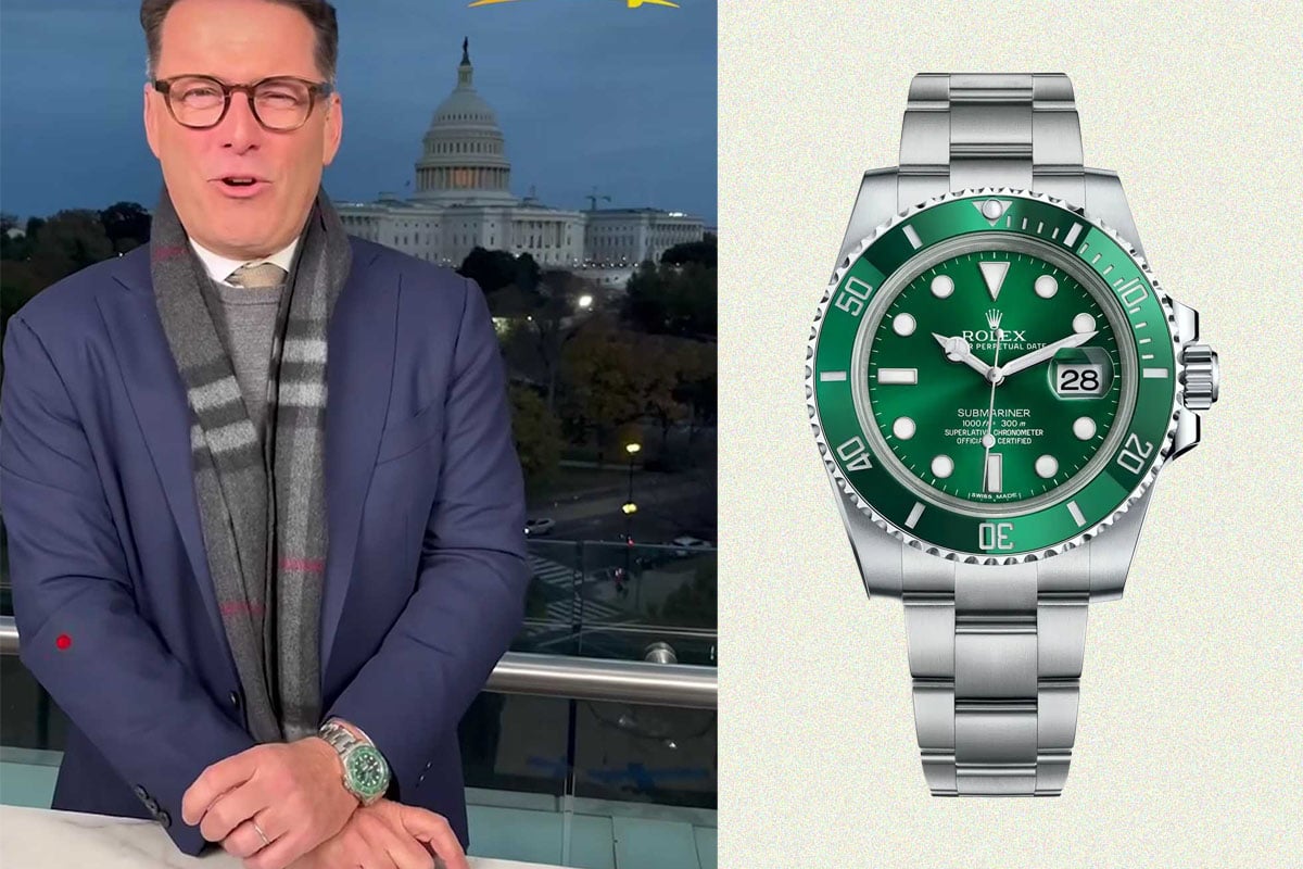 Person in suit wearing green Rolex Submariner.