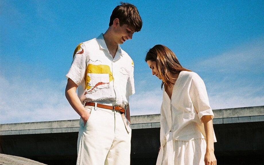 Couple in vibrant Australian menswear outdoors.