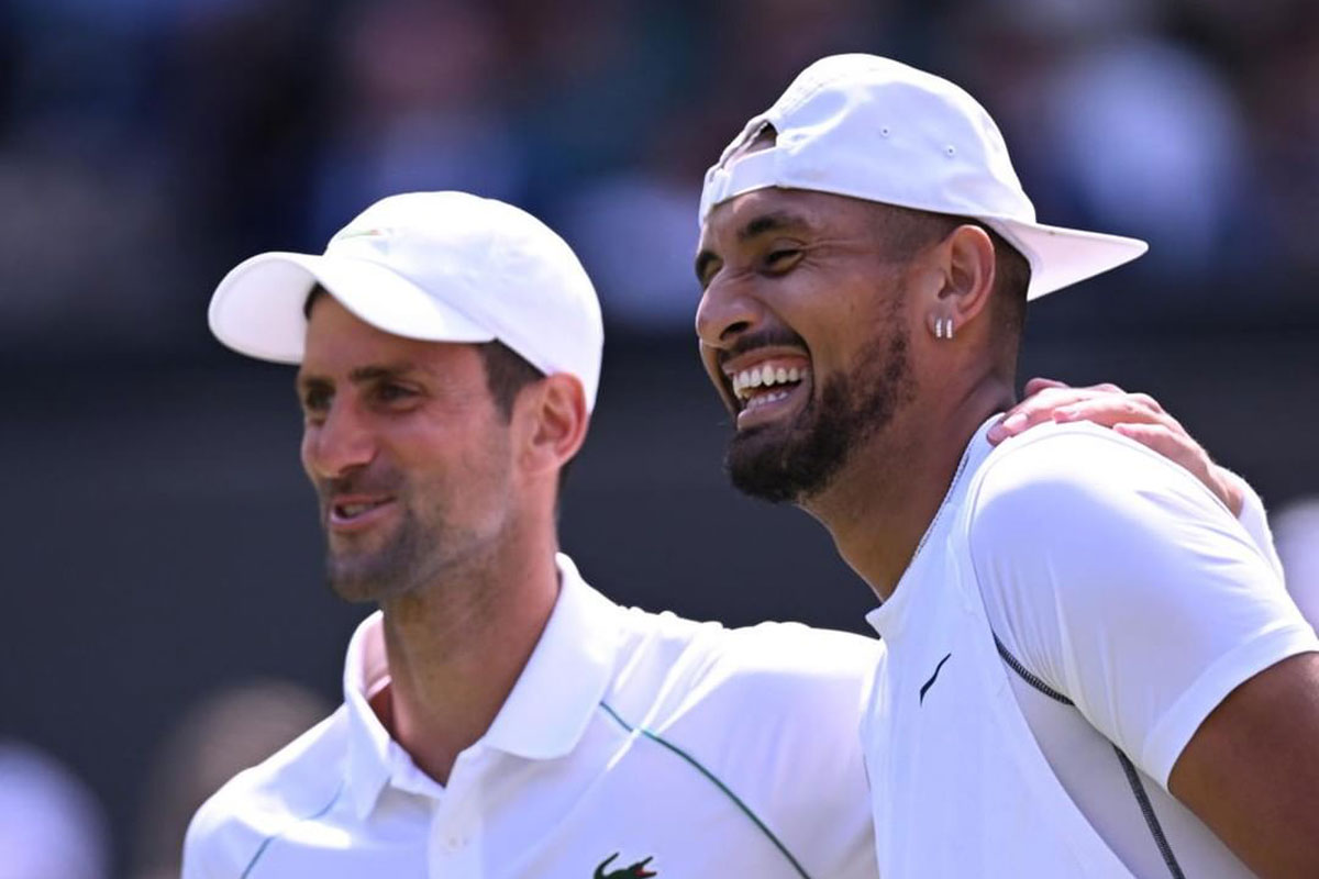 Tennis players share moment, possibly Wimbledon practice.