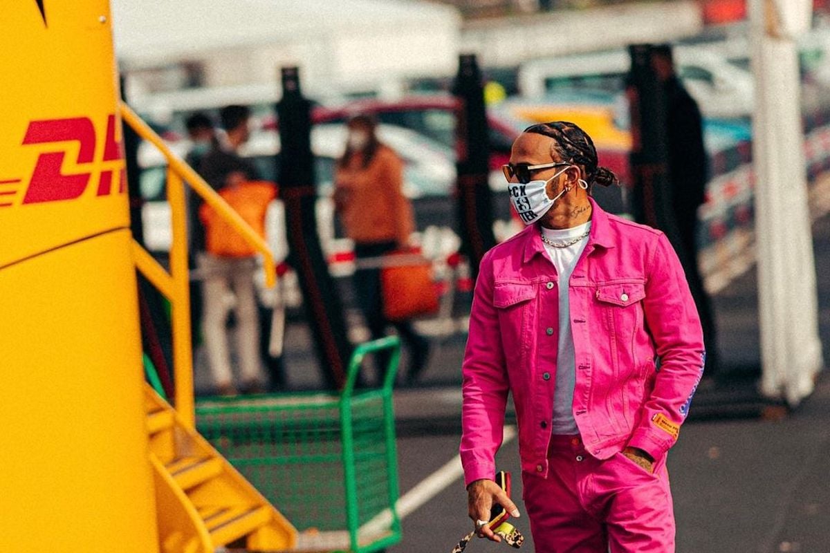 Person in pink emulates Lewis Hamilton style.