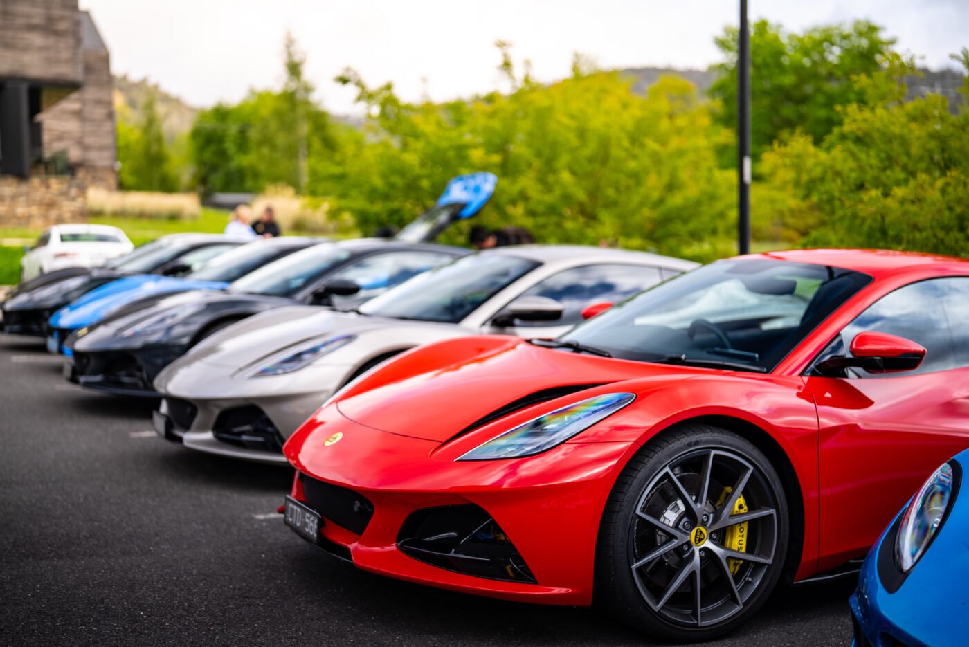 Row of Lotus sports cars with red foreground.