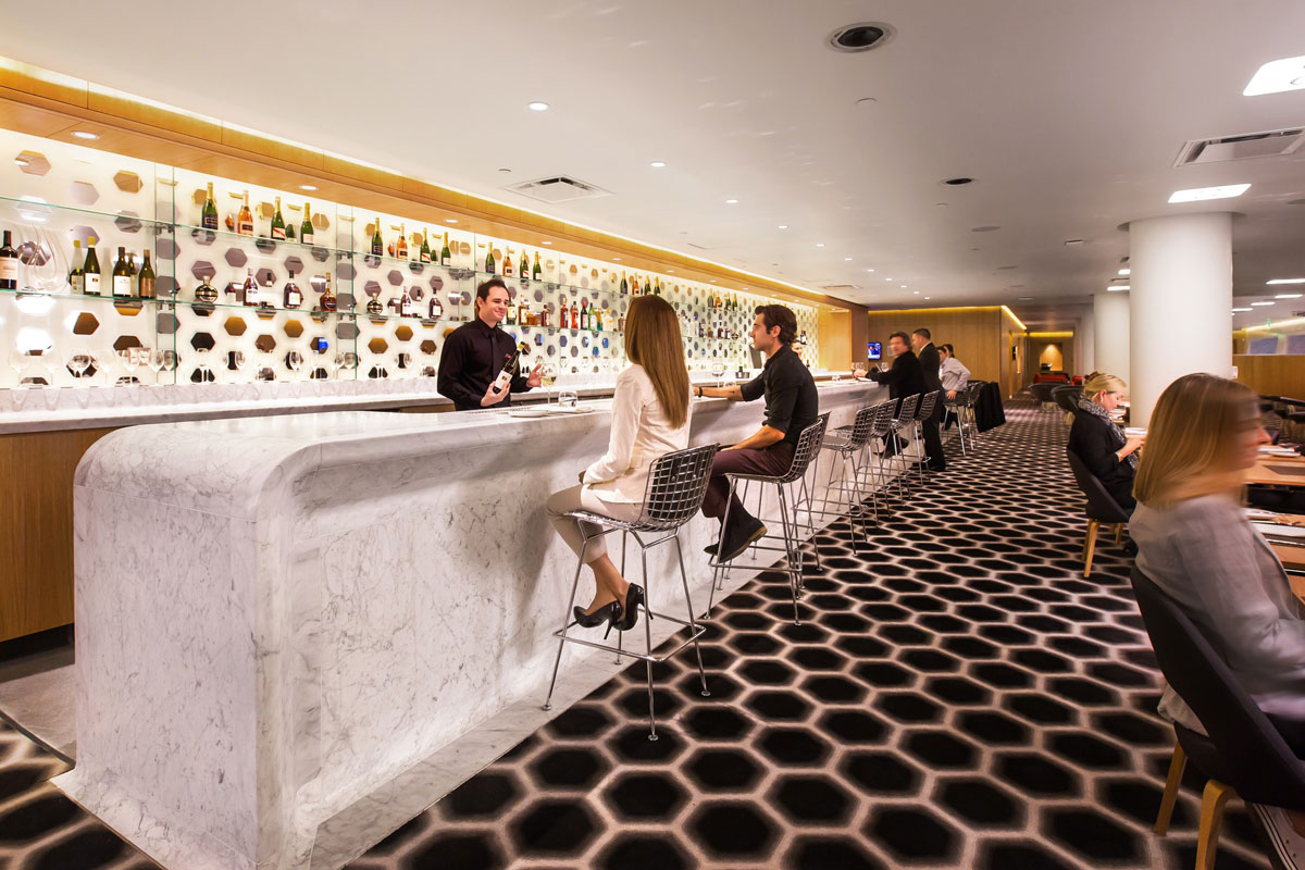 Stylish bar with marble and hexagonal design.