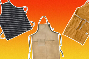 Three men's aprons against orange background.