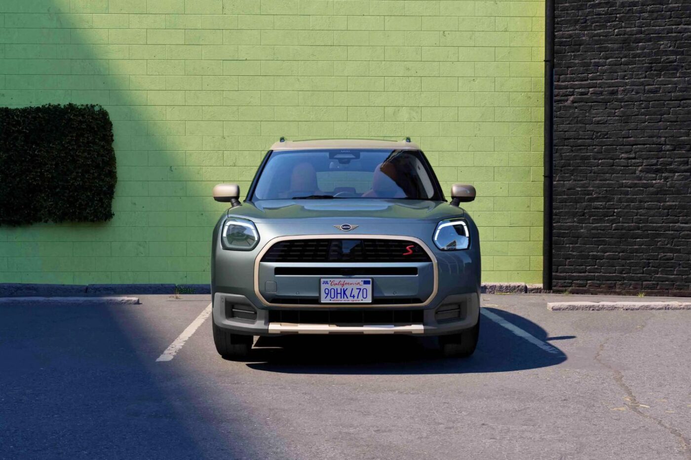 MINI Countryman parked against vivid walls.