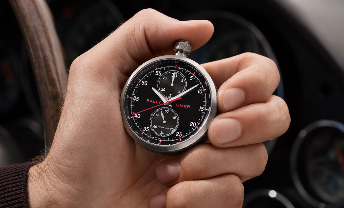 Hand holds $50K Montblanc stopwatch.