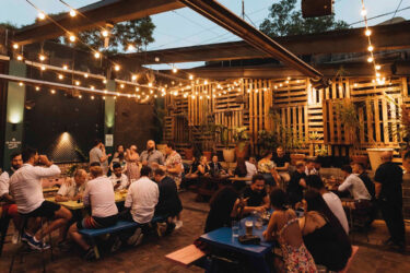 Newtown pub: outdoor dining with warm ambiance.