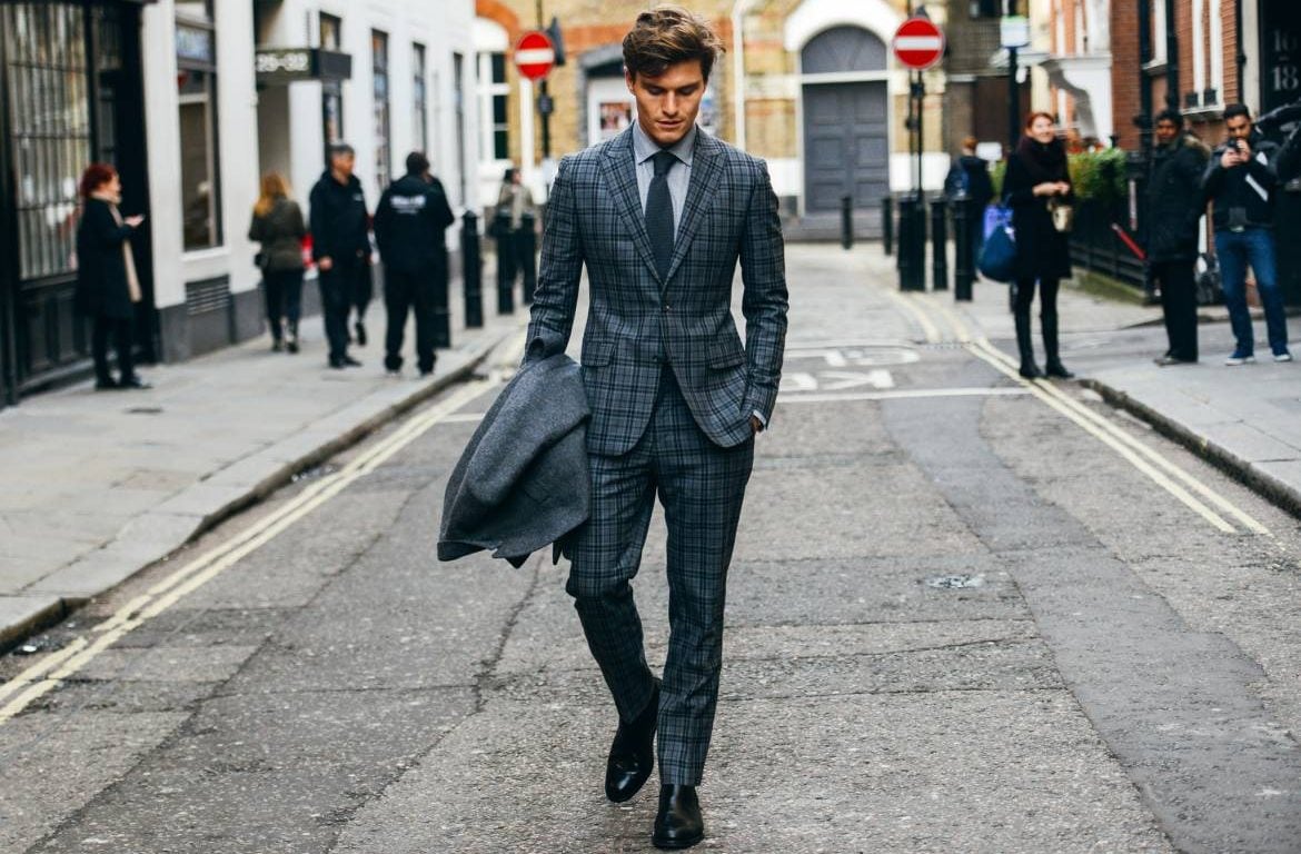 Skinny man in gray suit.