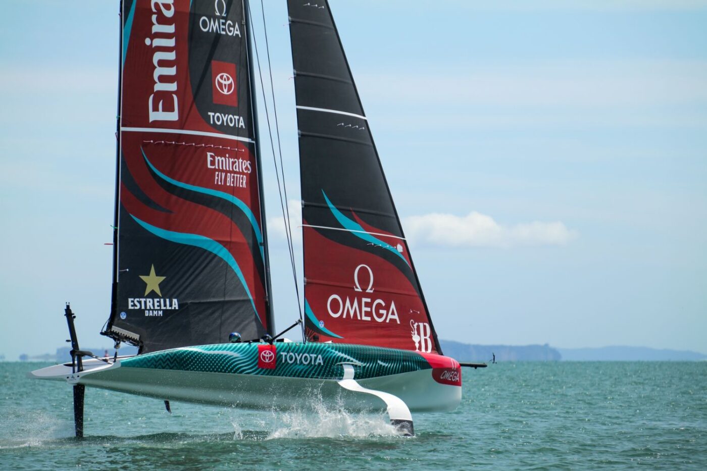 Emirates sailboat with sponsor logos.