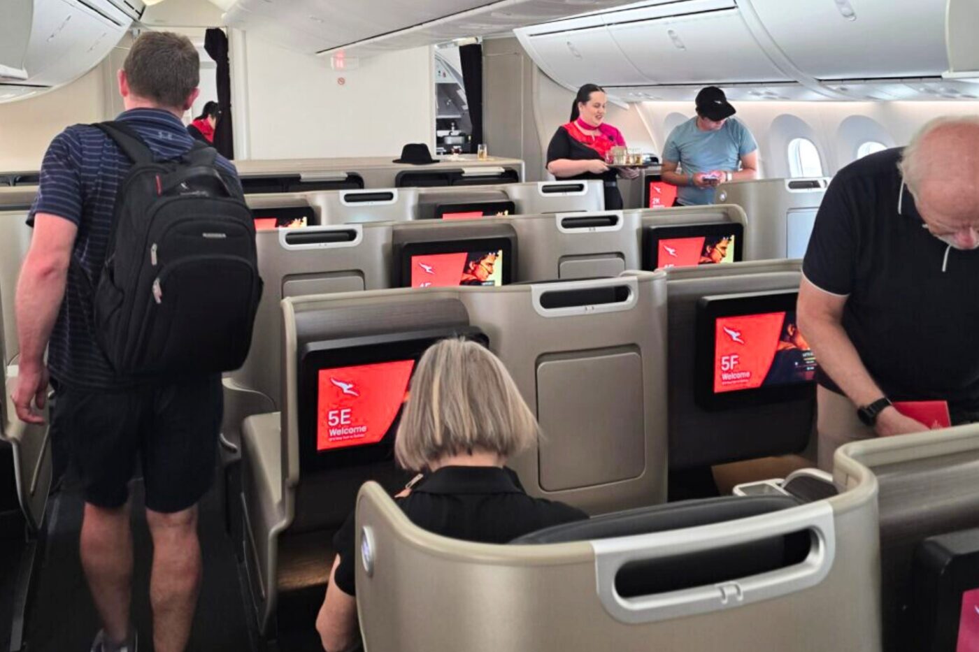 Passengers board Qantas 787 Business Class with entertainment.