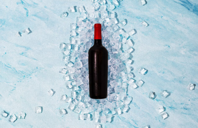 Red-capped wine bottle on ice, Aussie summer trend.