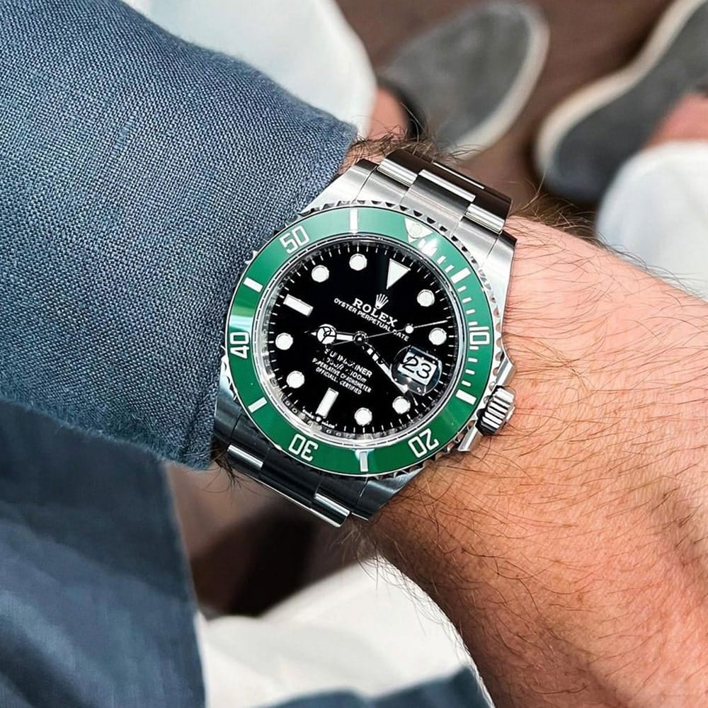 Wearing Rolex Hulk Submariner, relaxing post-election coverage.