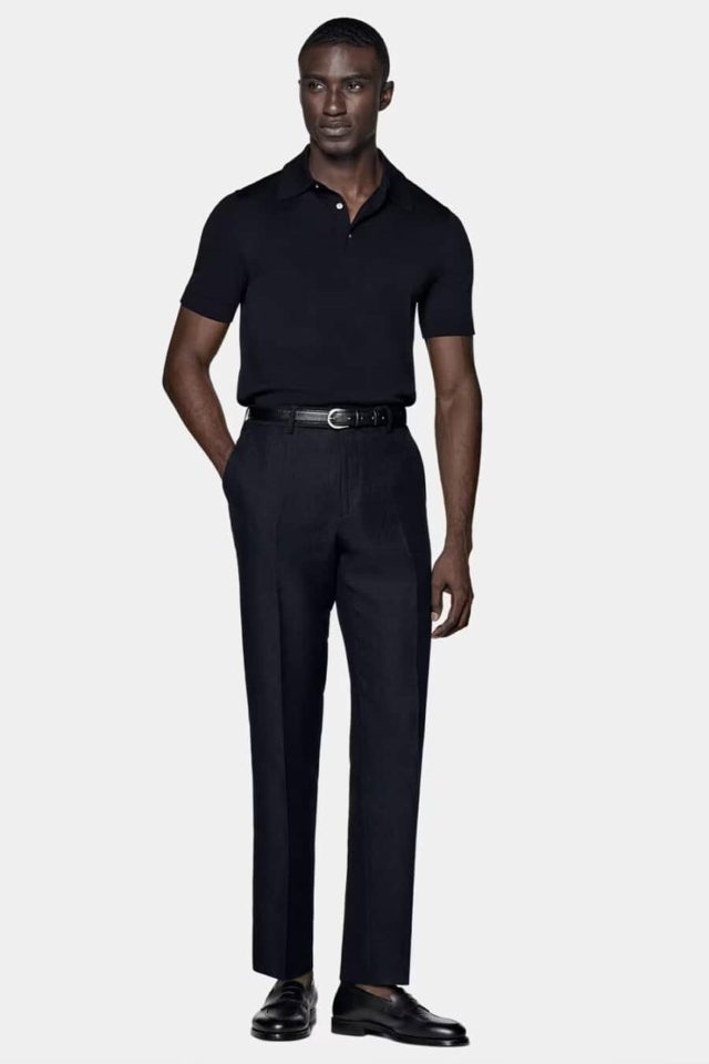 A man wearing all black smart casual attire