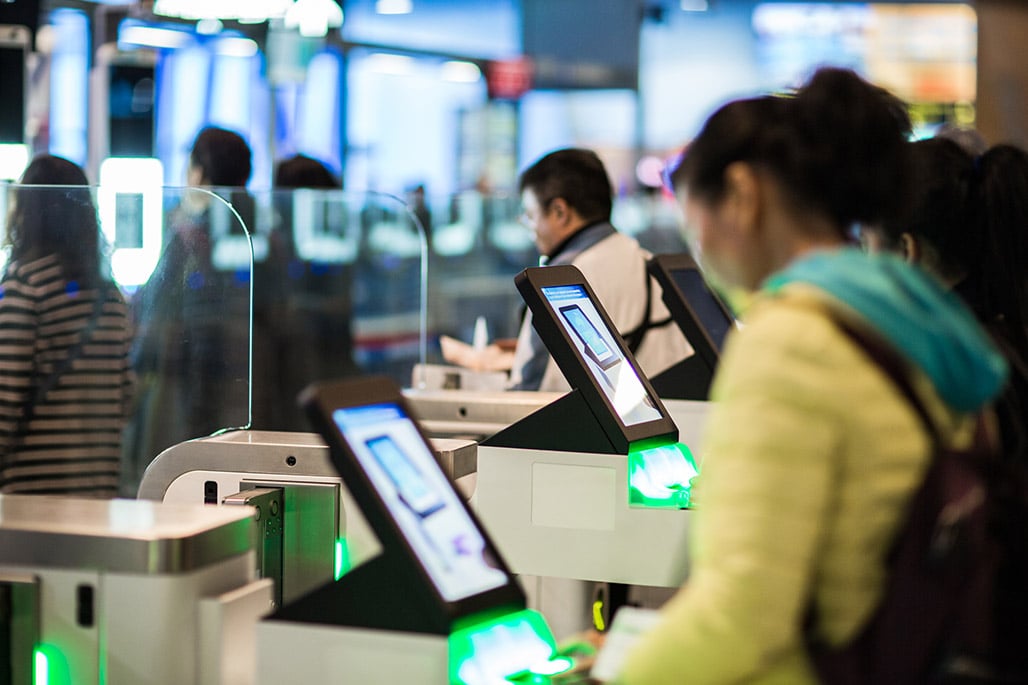 Australians use Global Entry e-gates in futuristic airport.