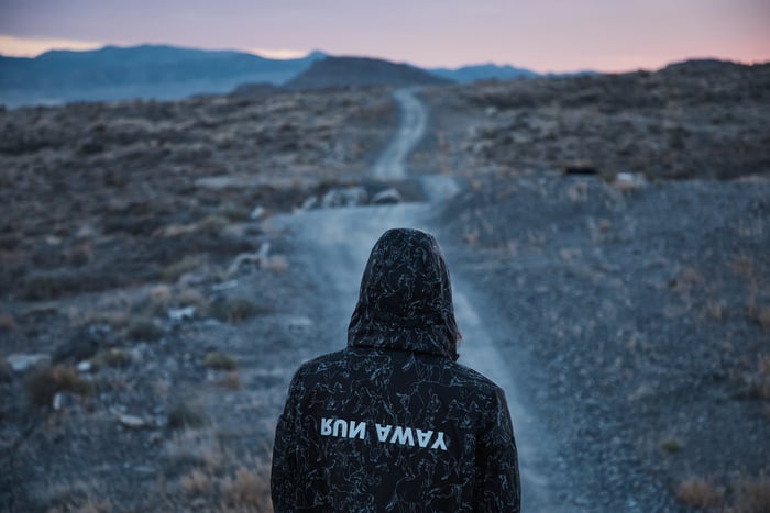 Person wearing jacket at dawn.