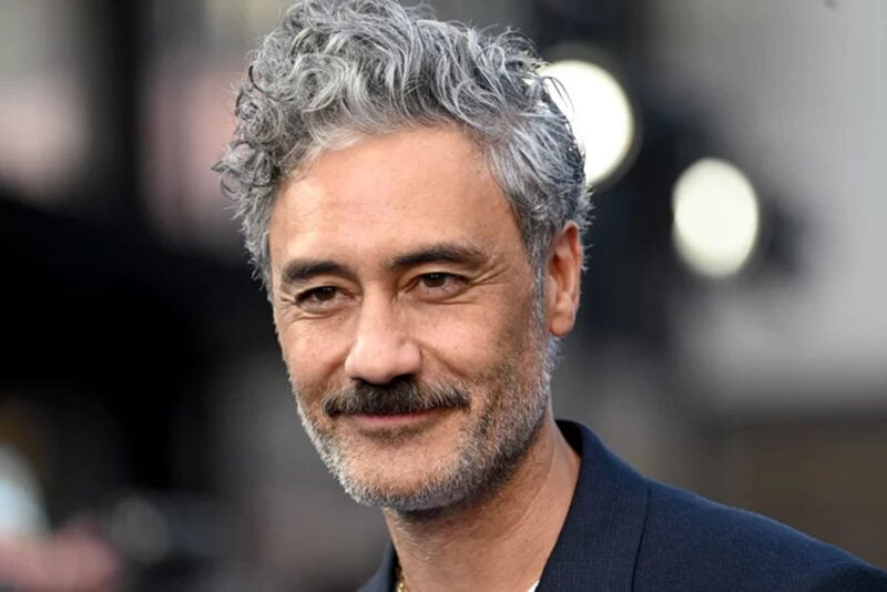 Curly gray-haired man, resembling New Zealand filmmaker.