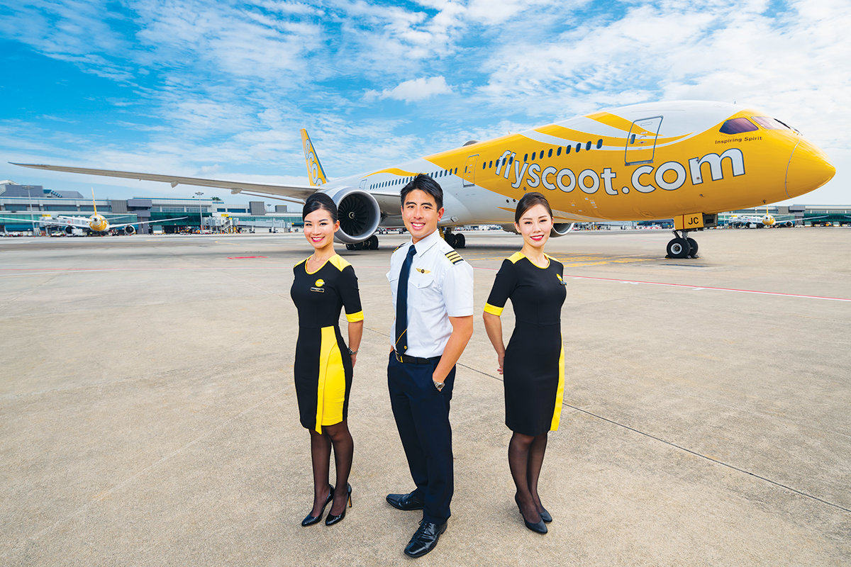 Scoot crew posing on tarmac.